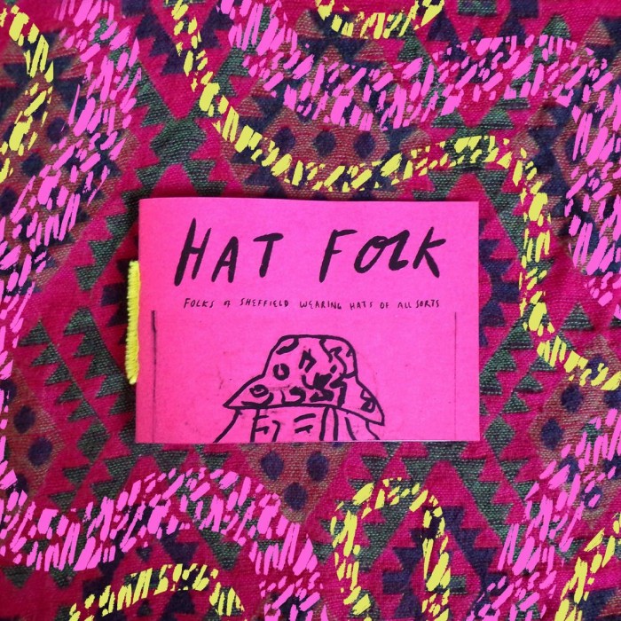 A bright pink zine called 'Hat Folk', made out of recycling paper