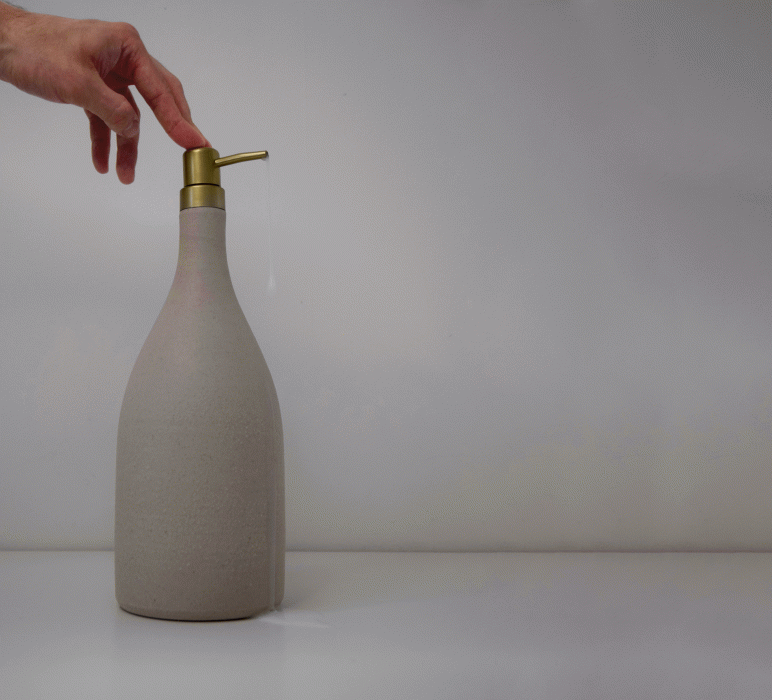 The ceramic soap dispenser has been thrown to a 1:40th scale of the actual size of the kilns. Standing with a twin, the two bottle forms replicate the architecture of the building and portray the atmosphere inside the space.