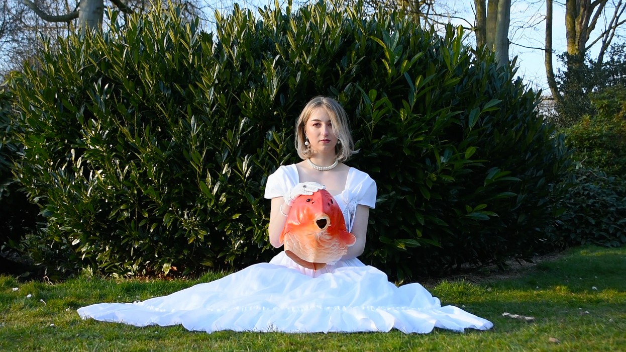 A photo of a woman and a fish head
