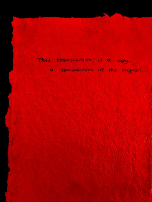 Text on red paper with translations in French, English, Morse code and Braille