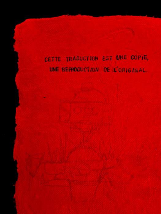 Text on red paper with translations in French, English, Morse code and Braille