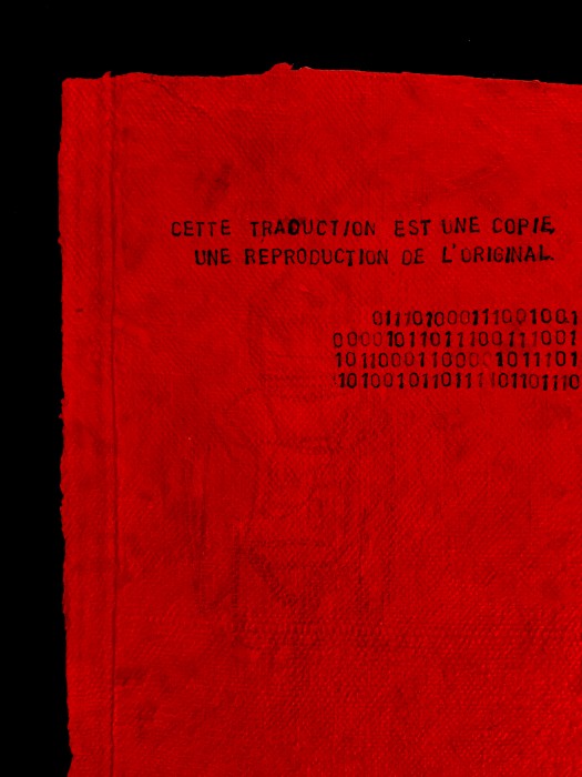 Text on red paper with translations in French, English, Morse code and Braille