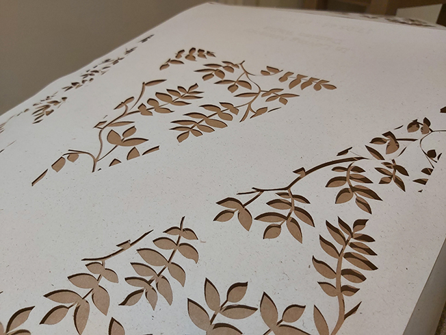 Once the paper leaves are broken off, a negative is revealed, creating a beautiful play on light