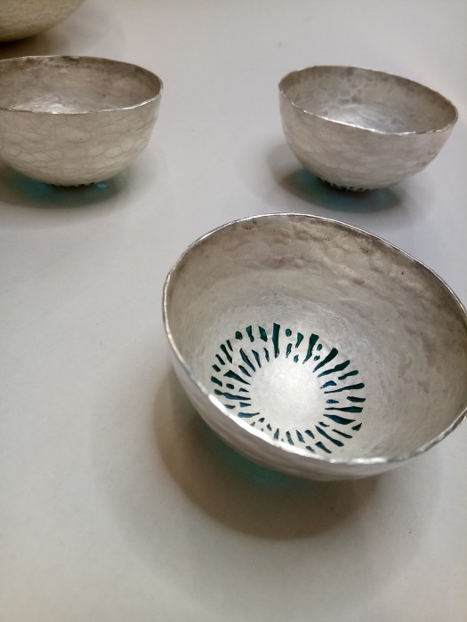 Three metal cups