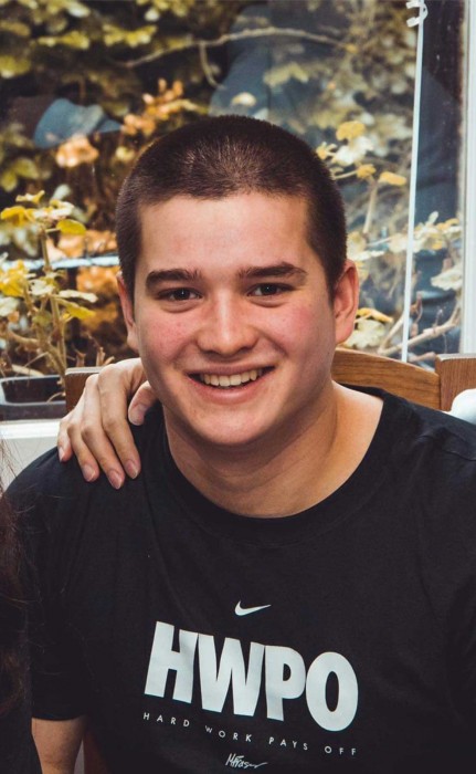 A man is smiling at the camera