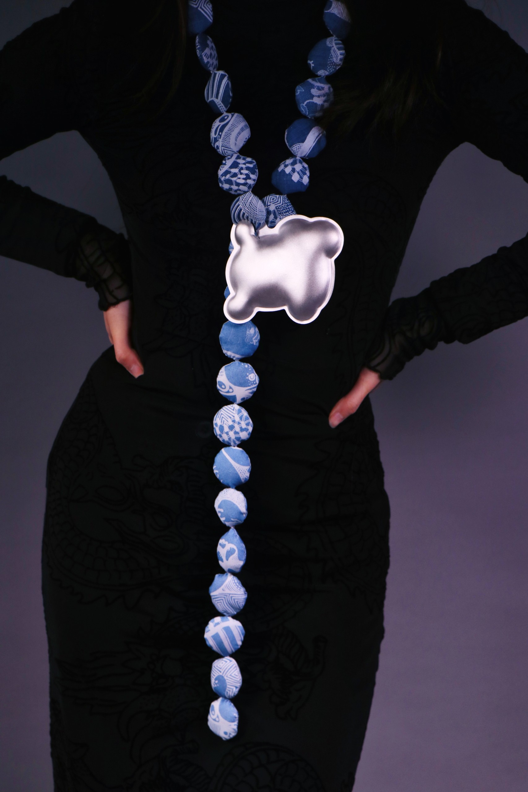 Hide Money, 2024. Silver plated brass, cyanotype fabric